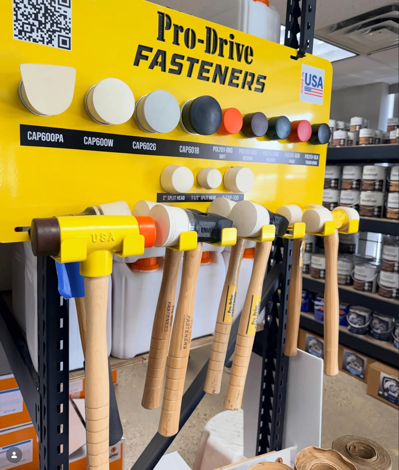 Pro-Drive Fasteners® mallets and replacement caps displayed on a yellow product board