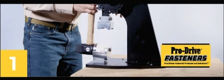 Pro-Drive Fasteners® Tipper-De-Tipper step 1 of 3: Seat the capped mallet head into the de-tipping arm.