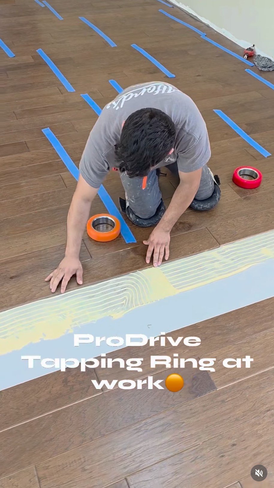 Installer using a Pro-Drive Fasteners® tapping ring during a flooring installation