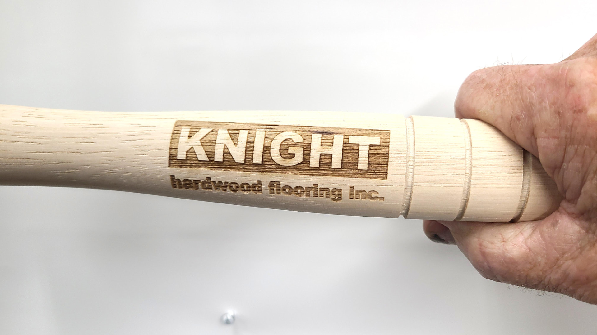Pro-Drive Fasteners® mallet handle engraved with the Knight Hardwood Flooring Inc. logo