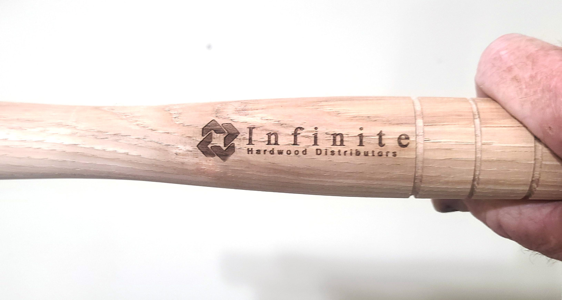Pro-Drive Fasteners® mallet handle engraved with the Infinite Hardwood Distributors logo